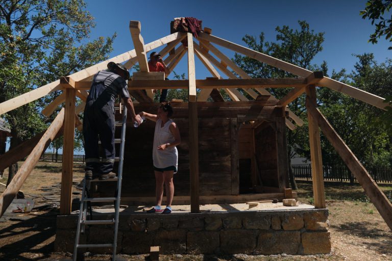 workers building a new roof construction