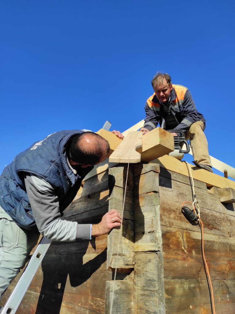 workers making new roof construction