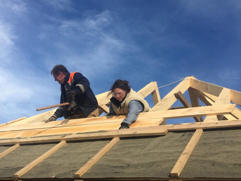 workers making new roof construction