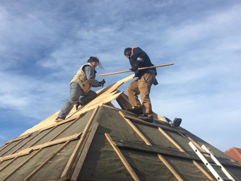 workers making new roof construction
