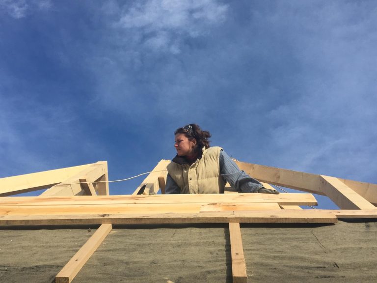 a worker making new roof construction