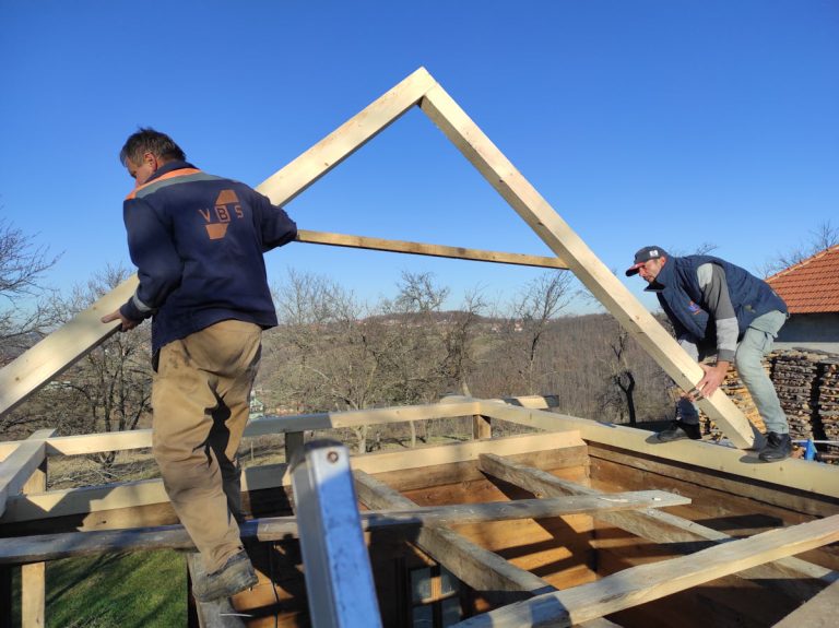 workers making new roof construction