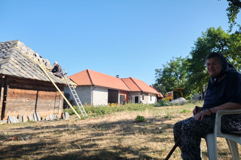 a grandmather sitthing in a shade