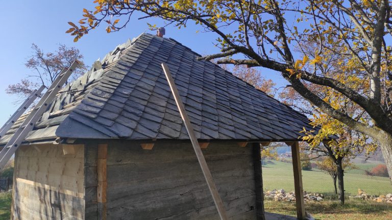 an old wooden cottage roof reconstruction
