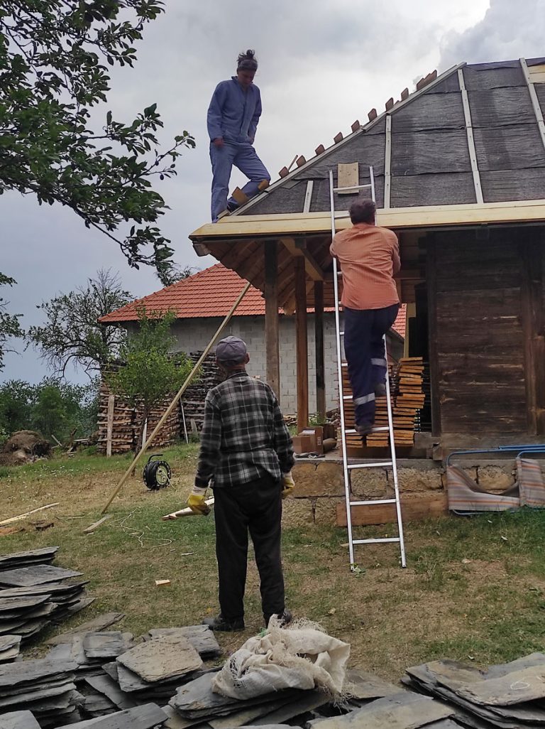 workers building a new roof construction