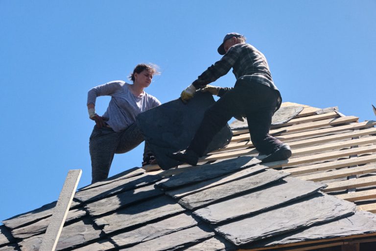 workers building a new roof