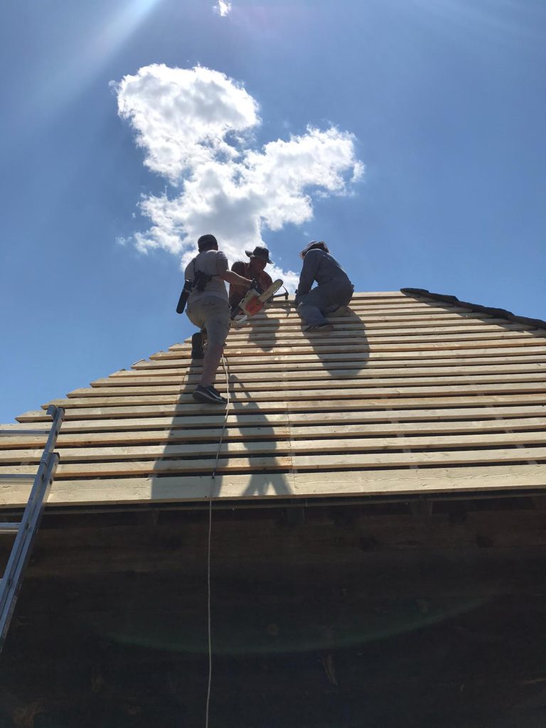workers building a new roof construction
