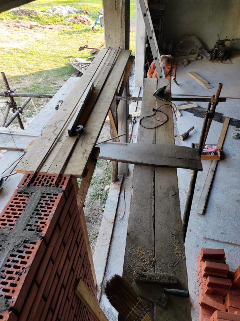 a brick wall and a scaffolding