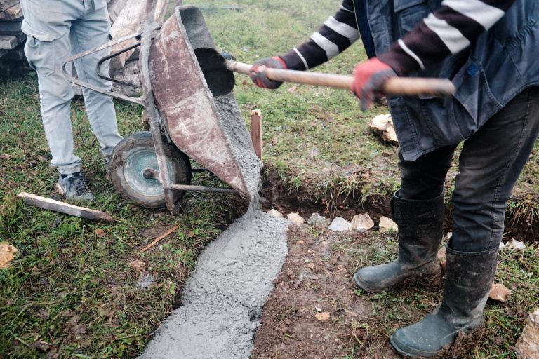 workers building a cottage foundation