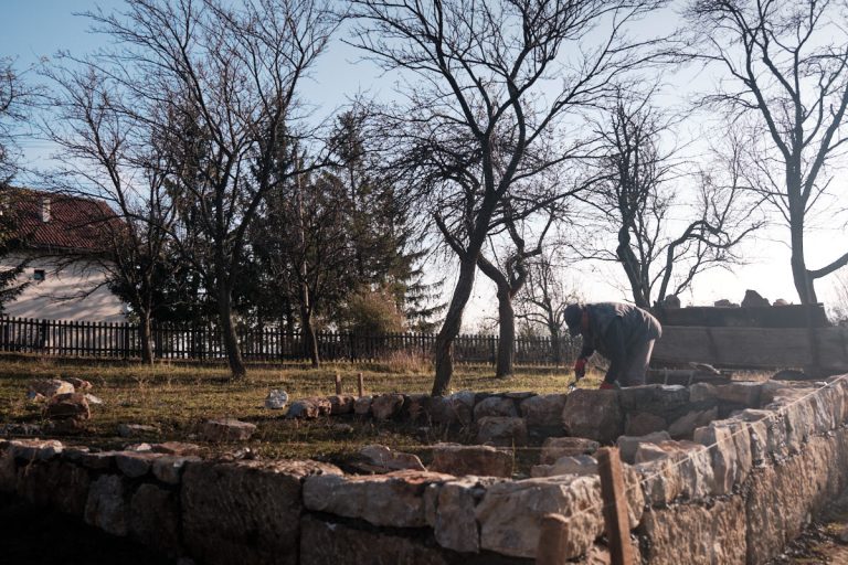 workers building a cottage foundation