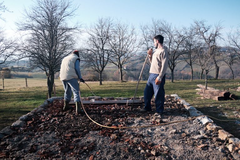 workers building a cottage foundation slab