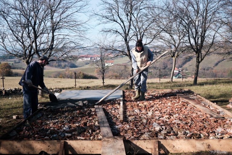 workers building concrete foundation