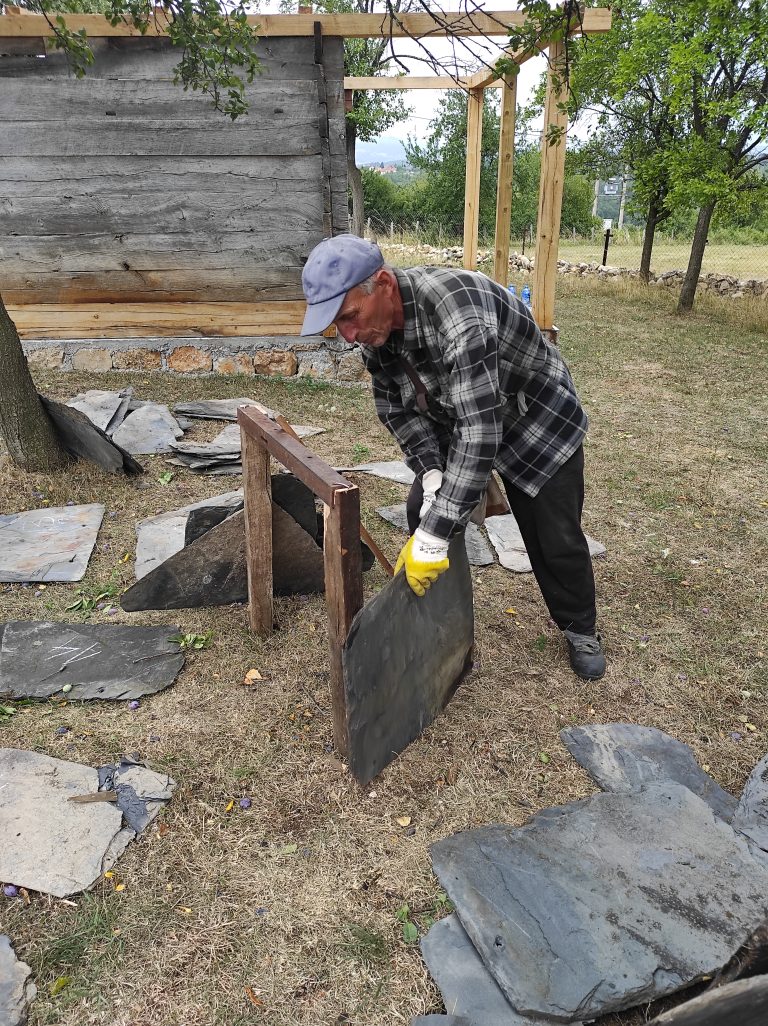 a worker holding a slate