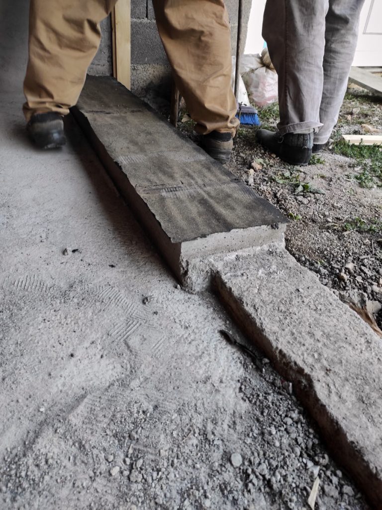 a tar paper on a concrete curb