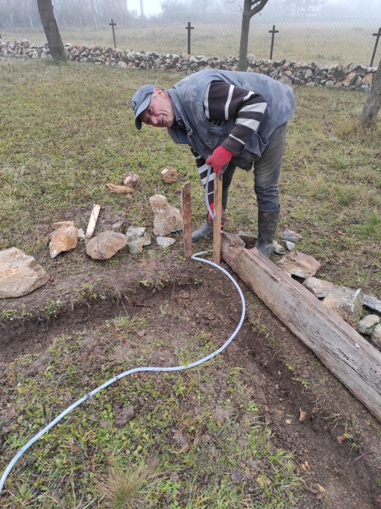 a worker building a cottage foundation