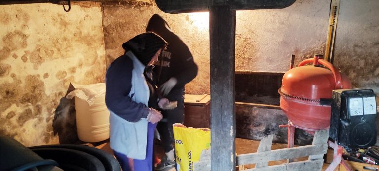 people cleaning the cellar