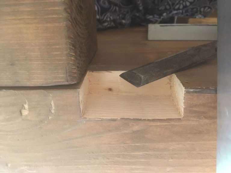 a chisle and a wooden beam joint