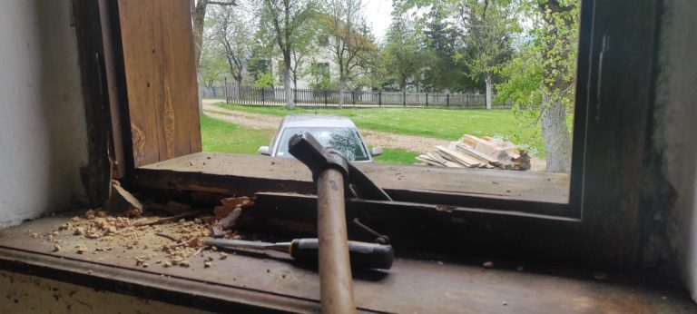 a clawhammer and old window