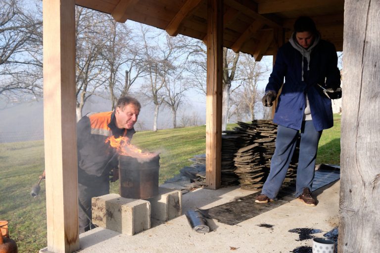 workers melting bitumen on a porch