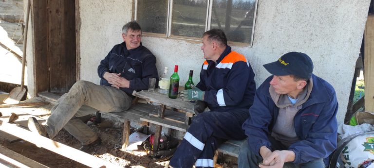 workers taking a break on a porch