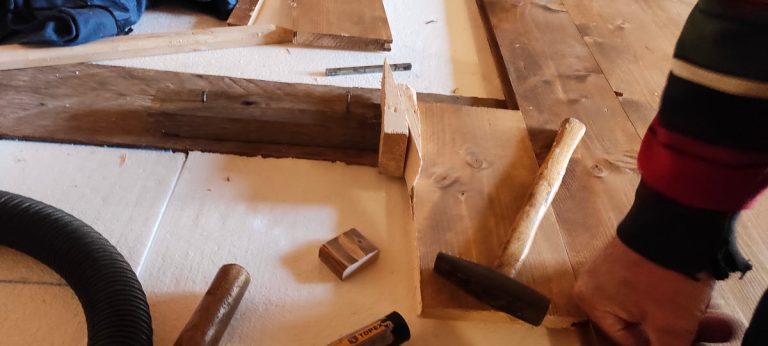 a hammer and wedges on a floor