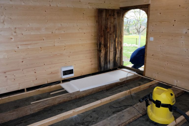 a wooden cottage isolation installation