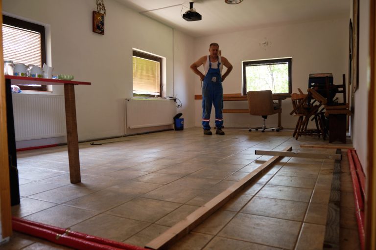 a worker in a room thinking about his next step