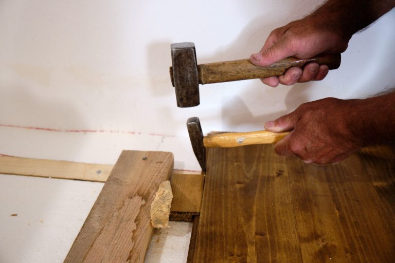 two hammers tightening the planks