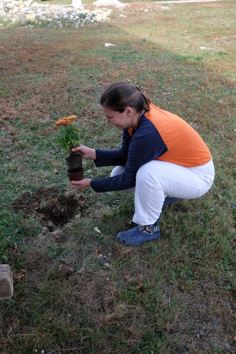 a girl planting flowers
