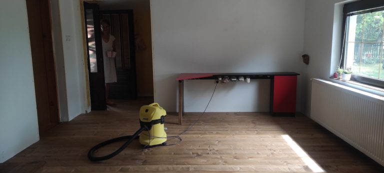 a vacuum cleaner in an empty room