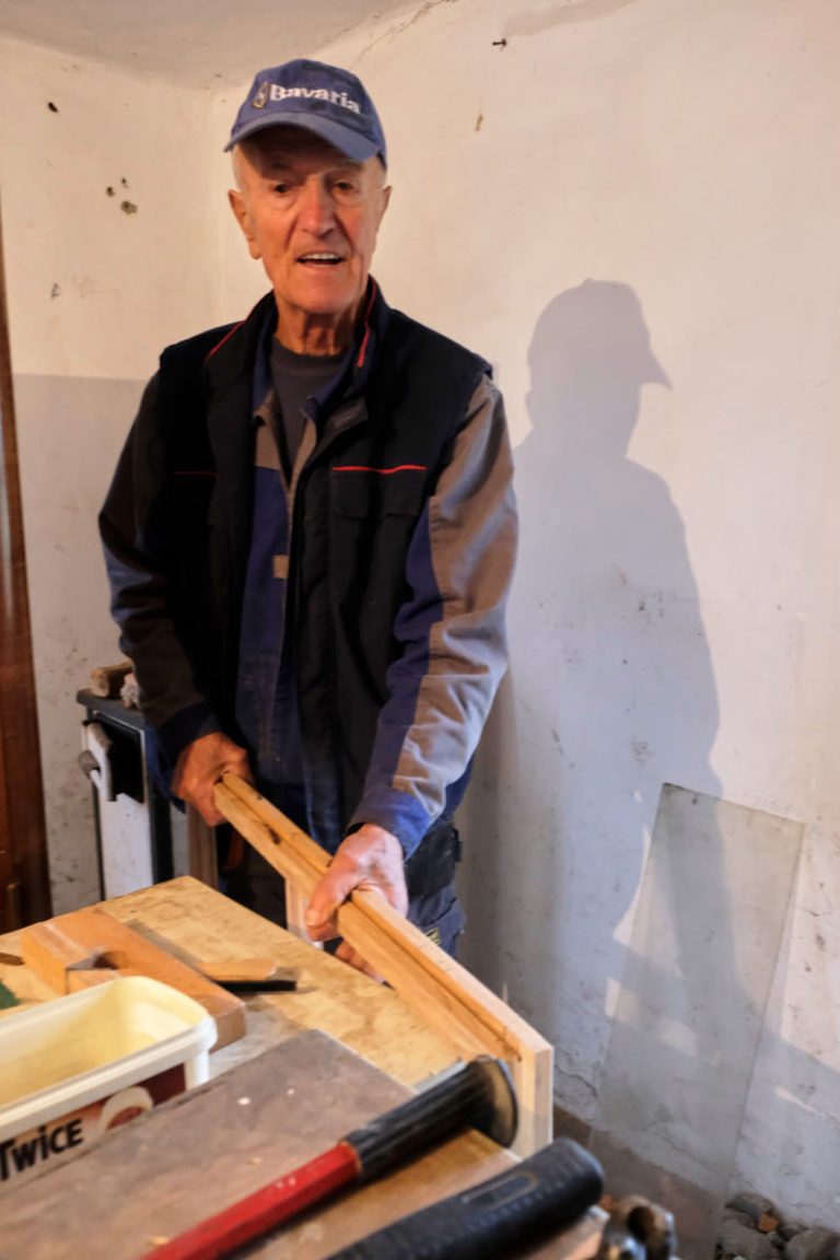 a worker holding a window frame
