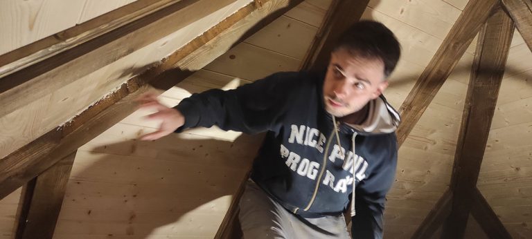 a man under the roof construction