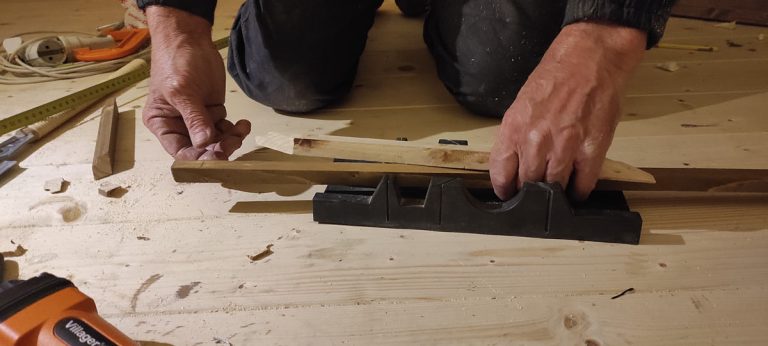 workers hands and wooden sticks