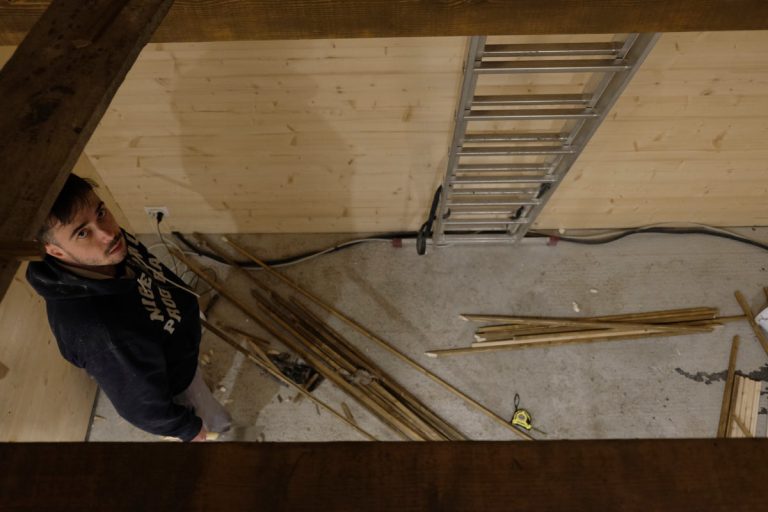 a boy in a wooden cottage
