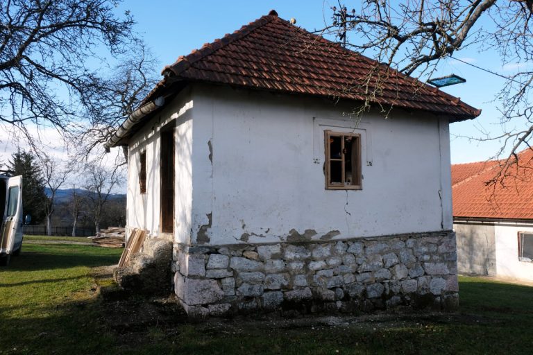 an old house with a new wooden window