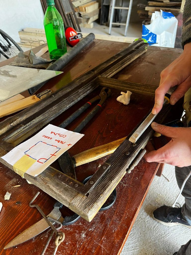 a chisel and an old window