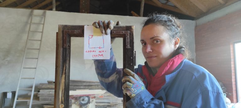 a woman and an old window frame