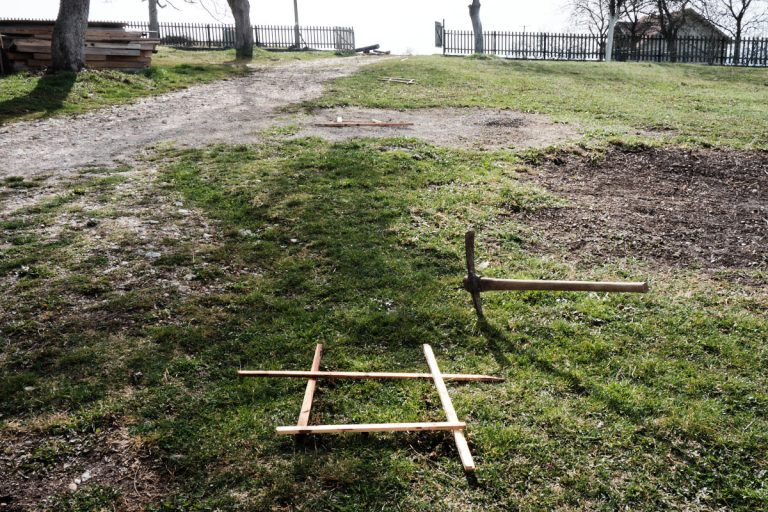 a mark for a hole and a pickaxe