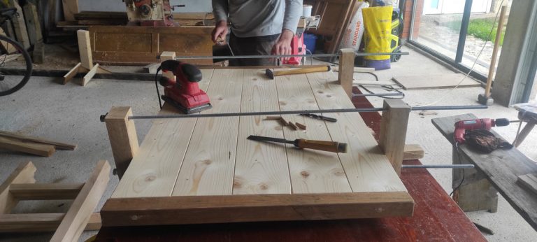 a man making wooden platform