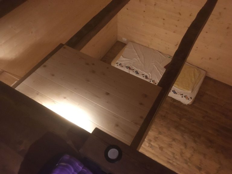 wooden platform in a wooden cottage