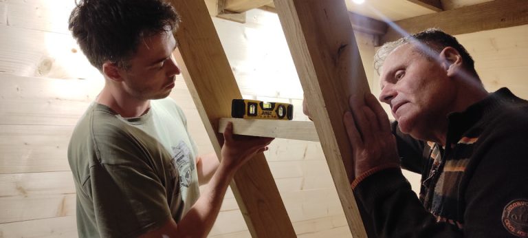 men leveling a wooden staircases