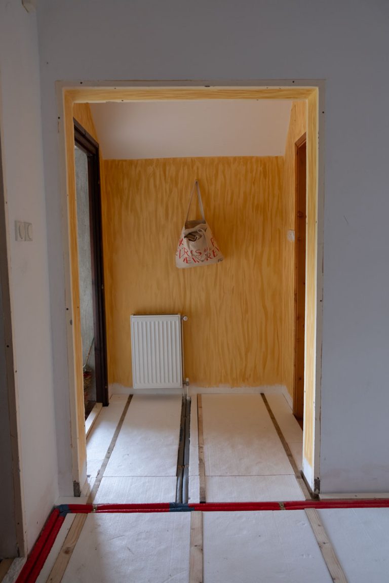 a door frame with styrofoam isolation layer on a floor