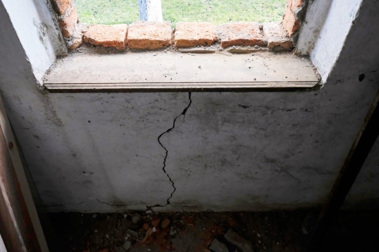 a window hole and a wall crack