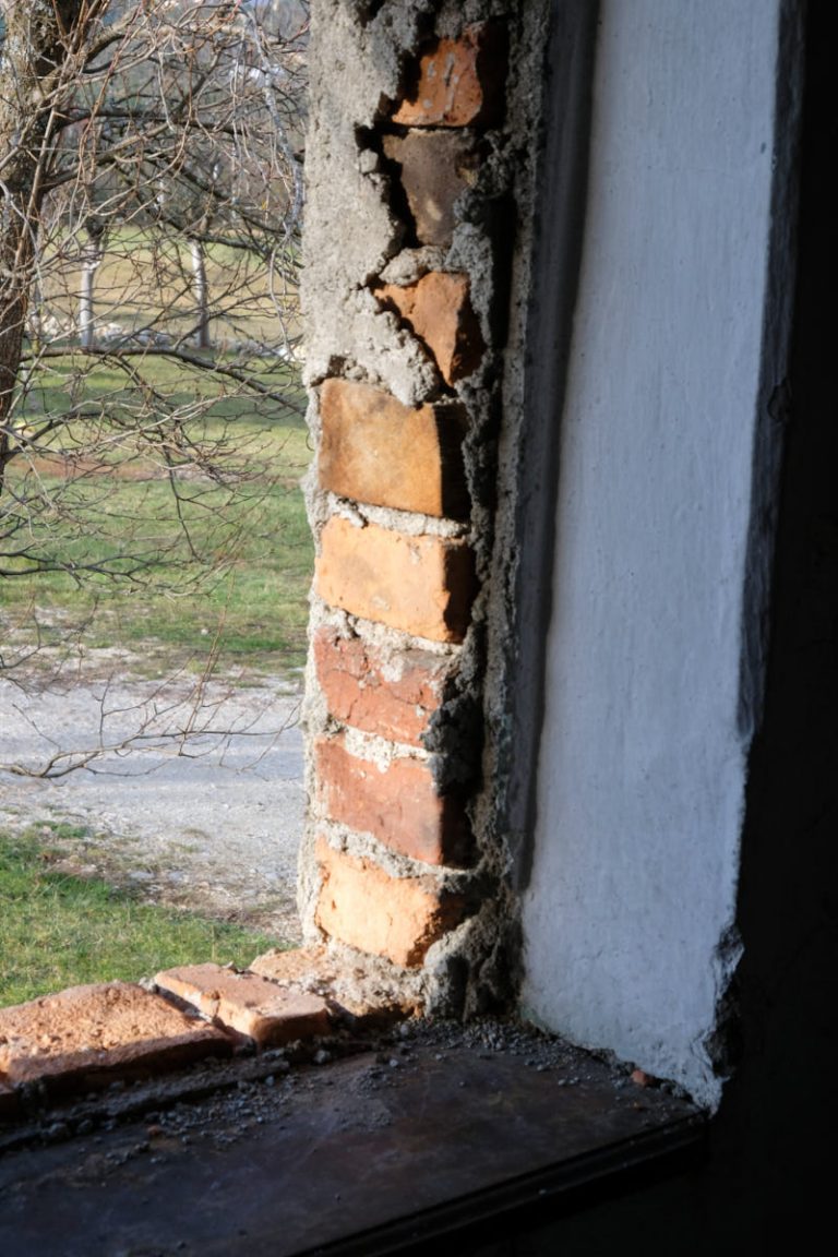 a detail od a window hole and a brick wall